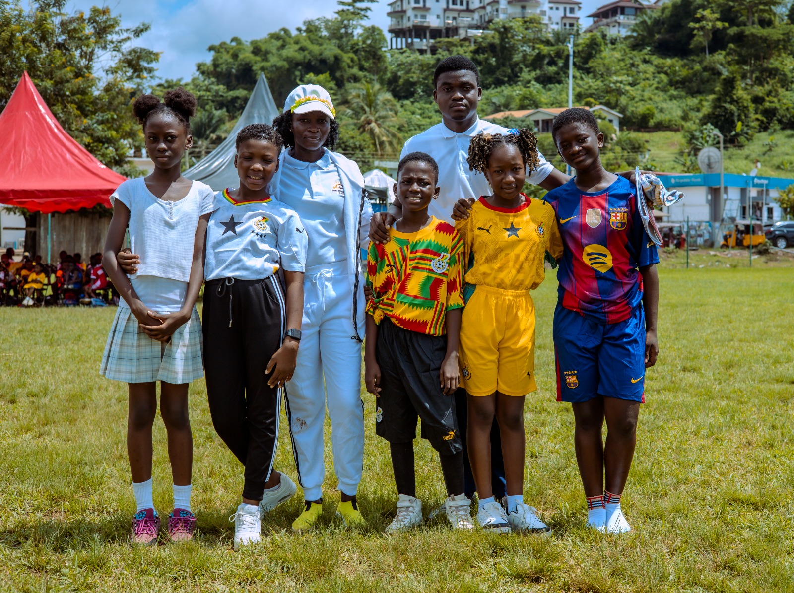 Students and staff enjoying outdoor sports day activities on school grounds