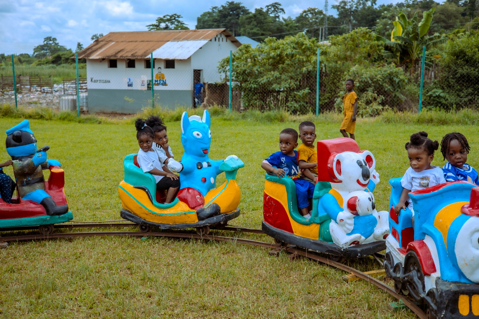 Young pupils enjoying playful outdoor train ride activities