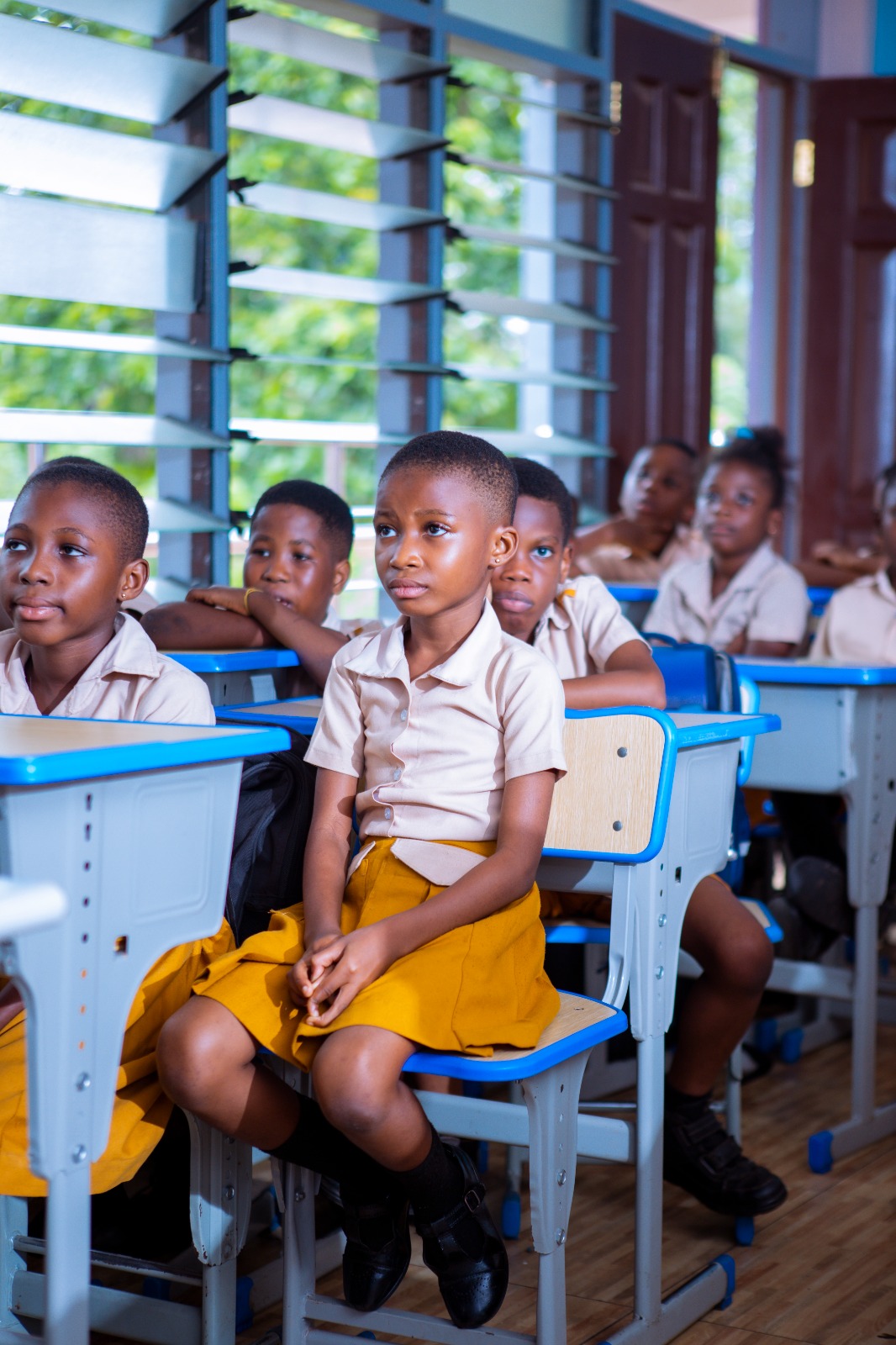 Students listening attentively during modern classroom lesson